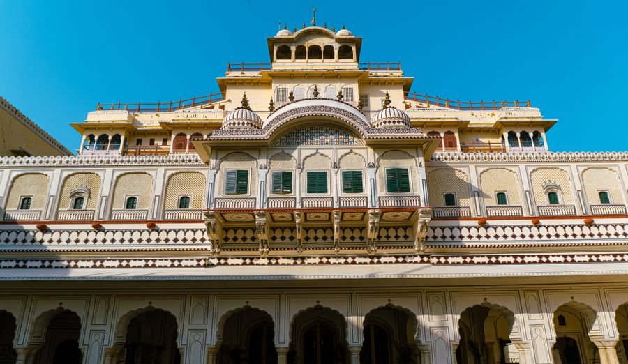 Ornate palace facade in Rajasthan under a clear blue sky